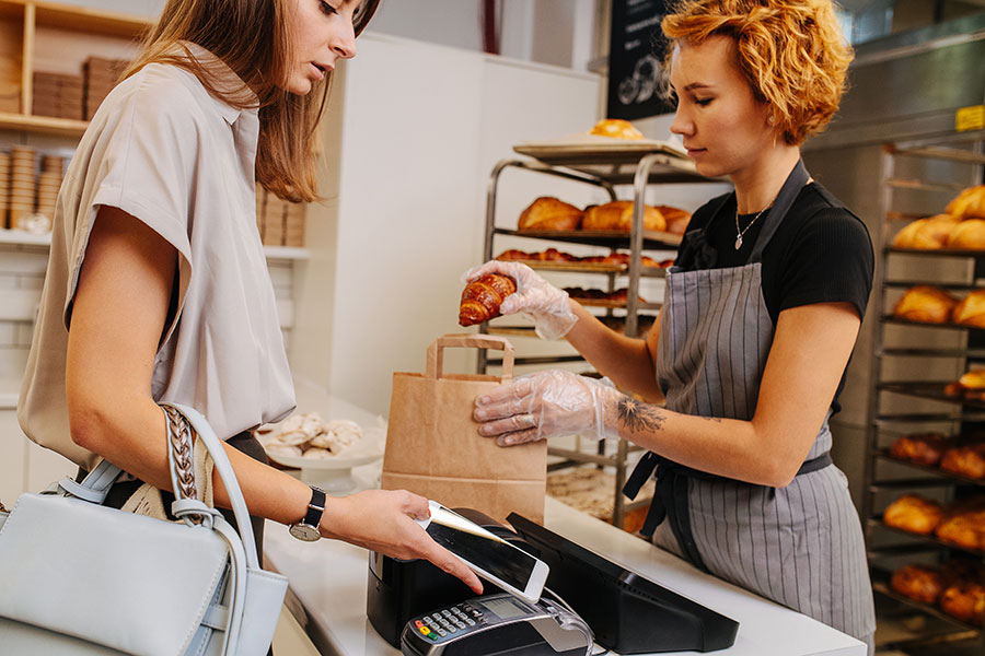 Woman buying from a local bakery