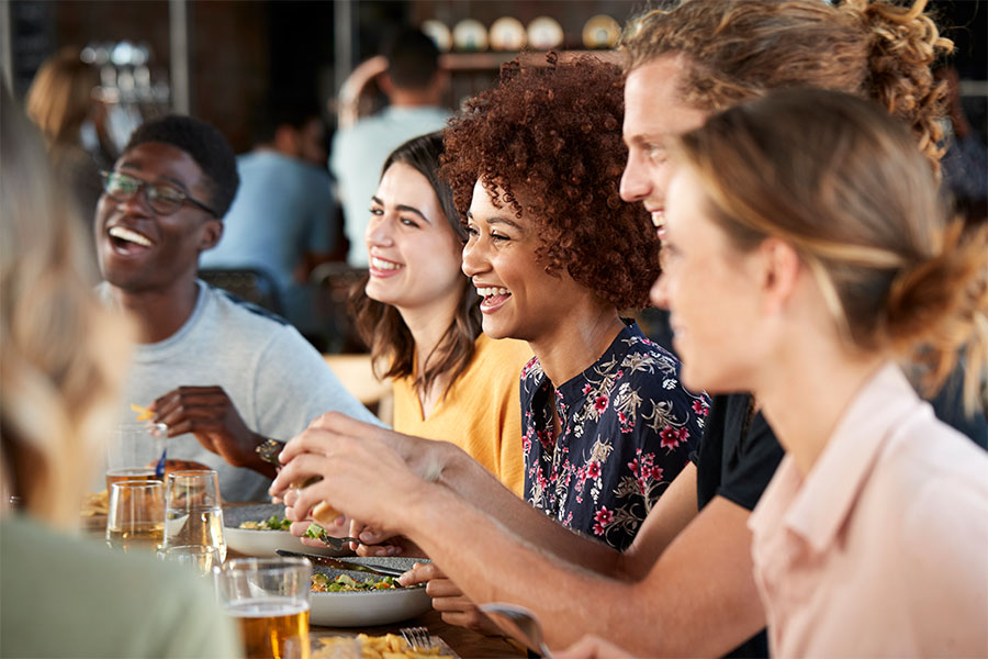 group enjoying food at restaurant