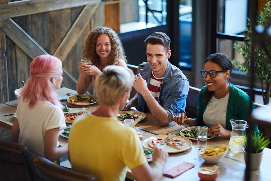 group enjoying meal at restaurant