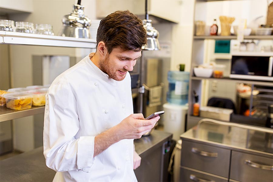 chef checking sms marketing report